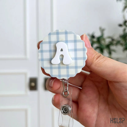Personalized letter A badge reel with raised white initial and blue plaid background for an ID badge holder