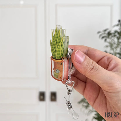 Acrylic layered plant shaker badge reel side view showing thickness and durable construction
