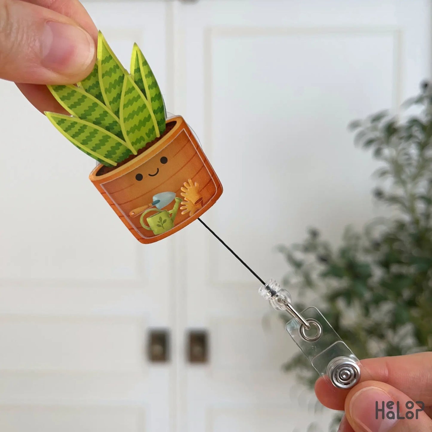 Retractable plant shaker badge reel for nurses, cute plant lover ID badge holder in use