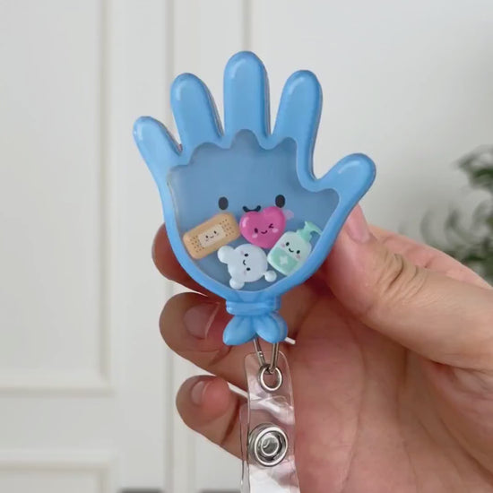 Medical glove shaker badge reel
