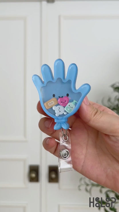 Medical glove shaker badge reel