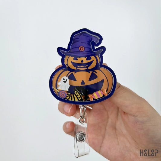 Cute Pumpkin Halloween Shaker Badge Reel with witch hat, ghost and Halloween candy shaker charms
