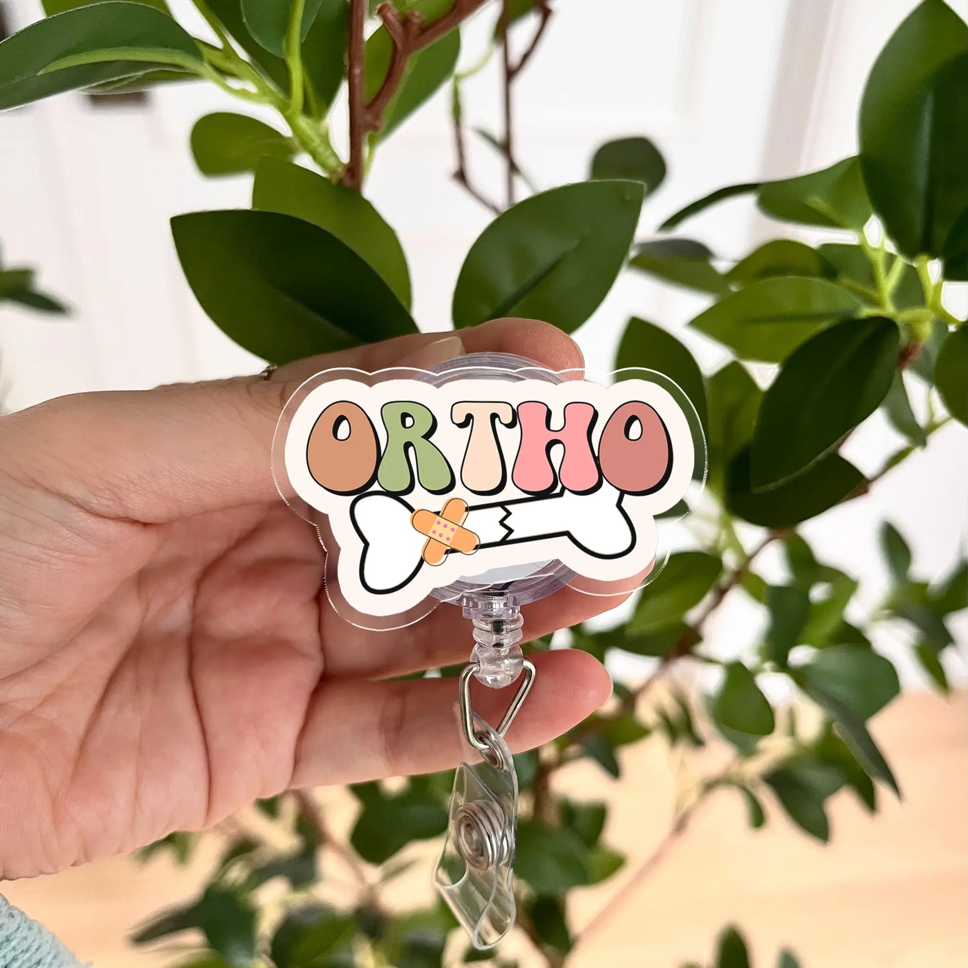 Funny orthopedic badge reel from Healoop – retractable ID holder with bone design