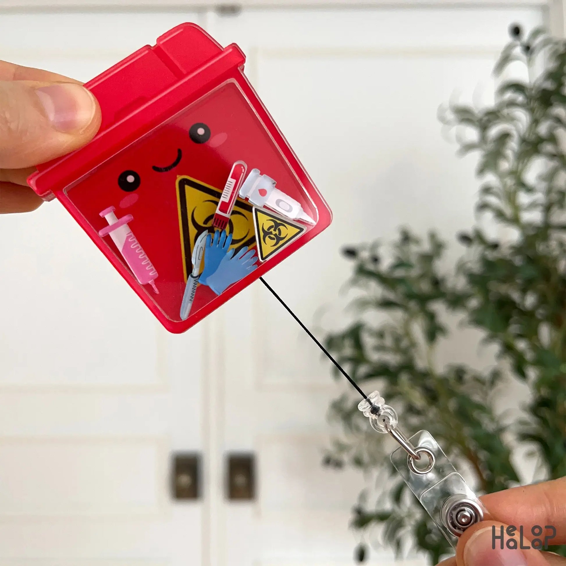 Retractable sharps container badge reel for nurses and healthcare staff