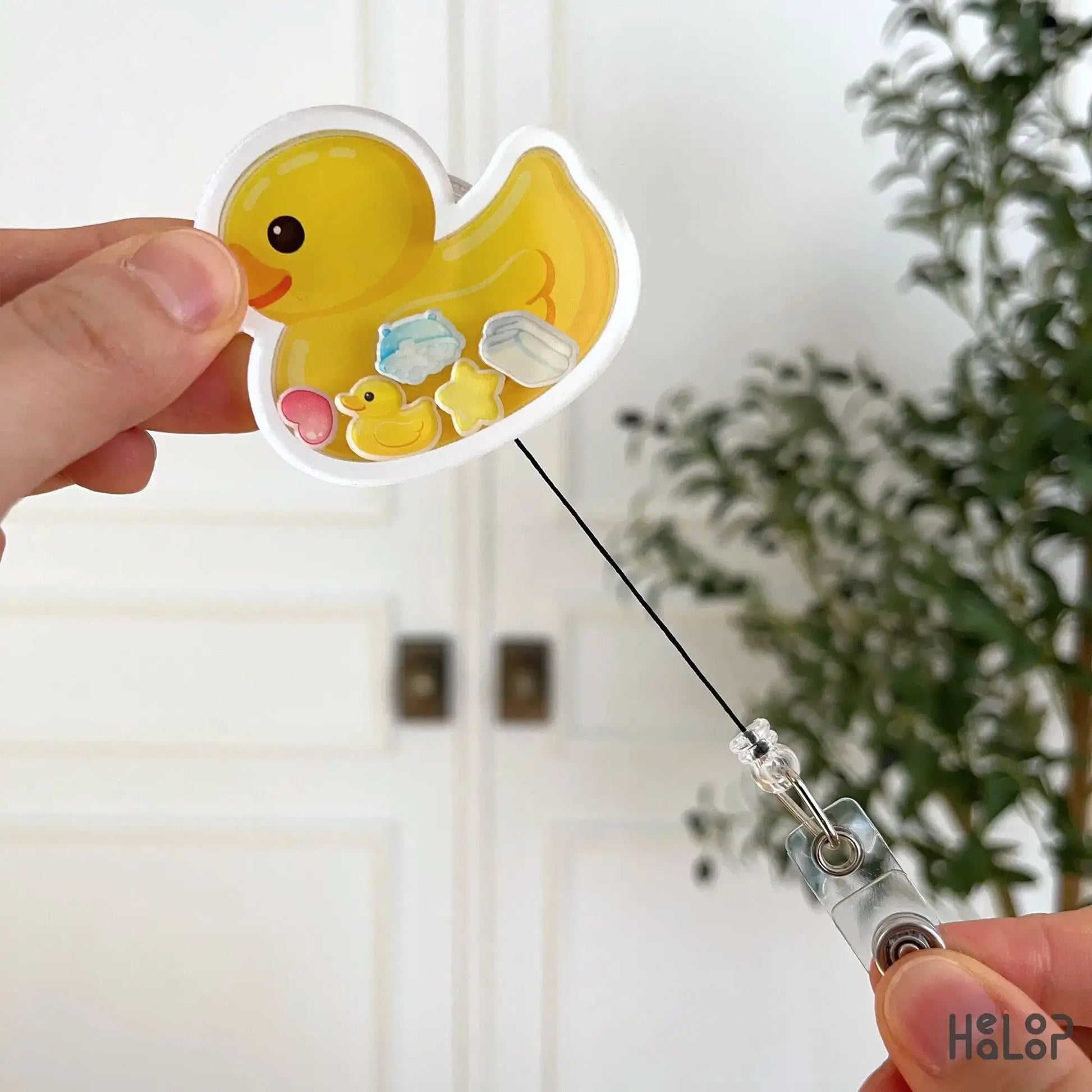 Retractable rubber duck badge reel showing pull cord nurse ID holder