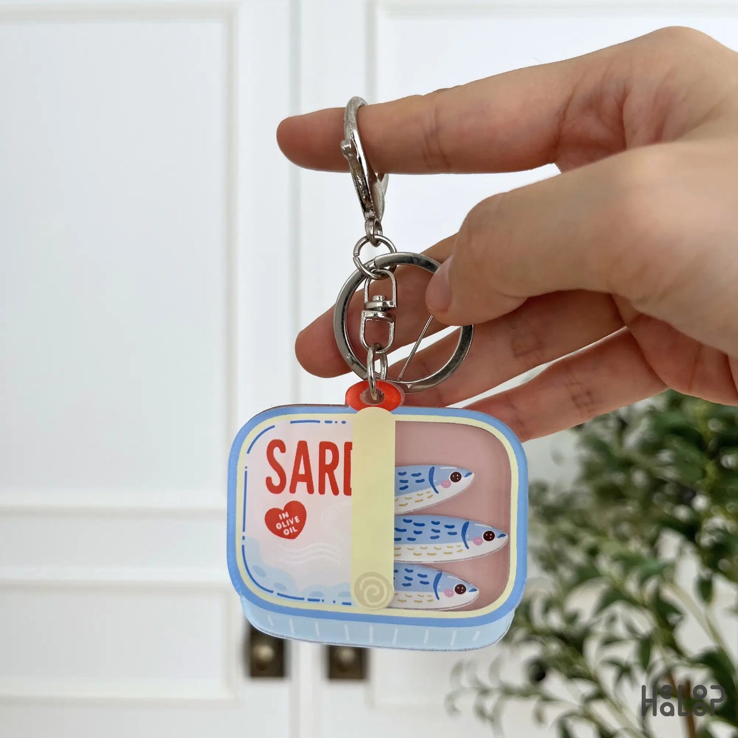 Sardine Shaker Keychain featuring cute moving fish charms inside a colorful tinned sardine design.