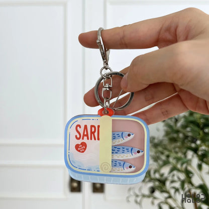 Sardine Shaker Keychain featuring cute moving fish charms inside a colorful tinned sardine design.