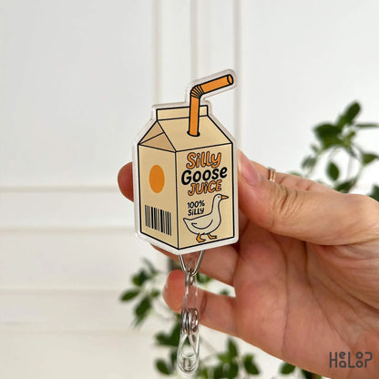 Silly Goose Juice Badge Reel front view – cute funny design with straw milk carton, perfect for nurses
