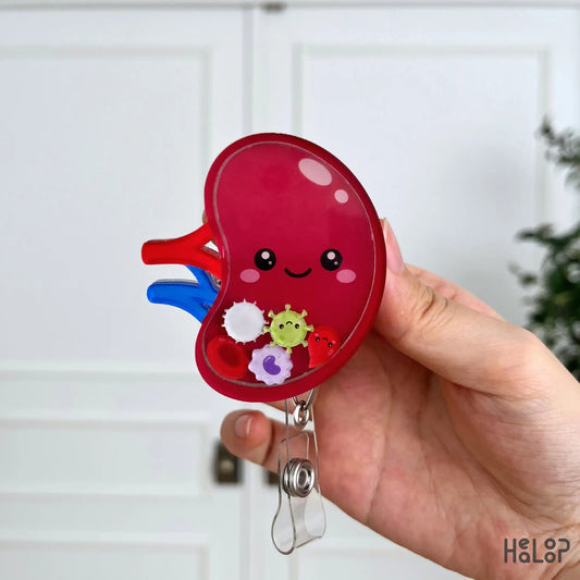 Adorable spleen anatomy shaker badge reel with smiling organ illustration and colorful blood cell themed movable charms.