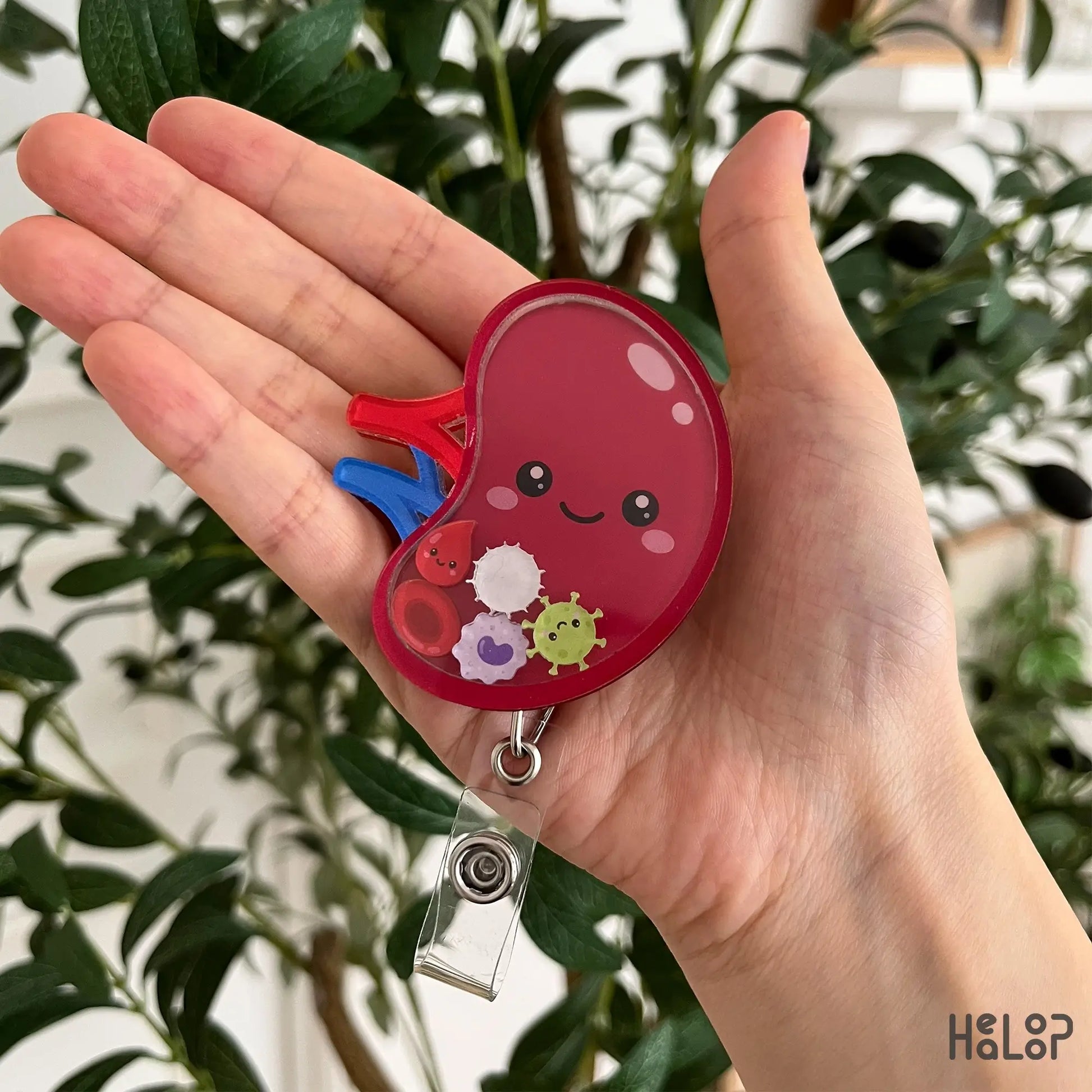Cute spleen shaker badge reel featuring movable blood cell charms for hematology professionals, nurses, doctors, and medical students.