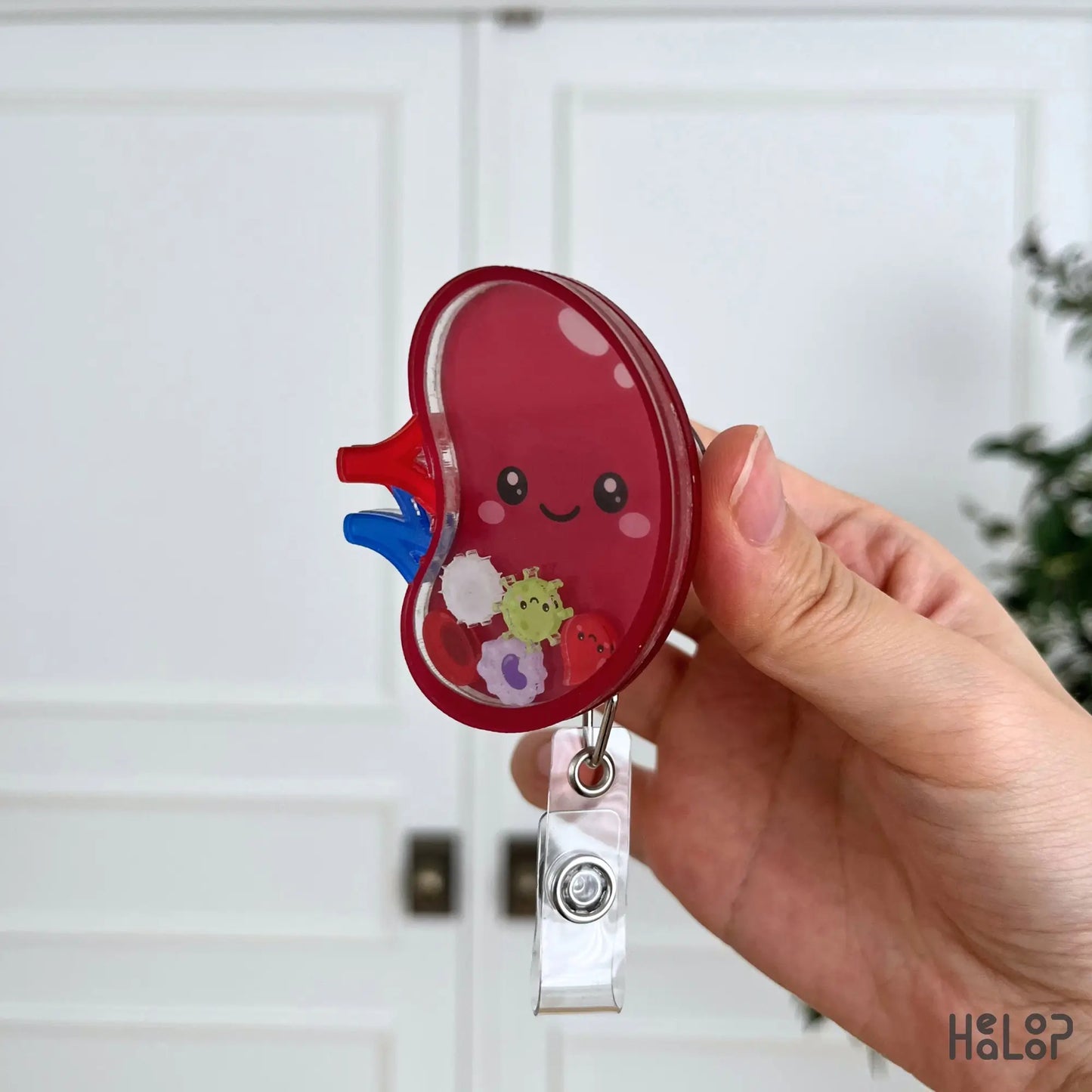 Layered acrylic spleen shaker badge reel side view highlighting the thick construction and freely moving shaker charms.