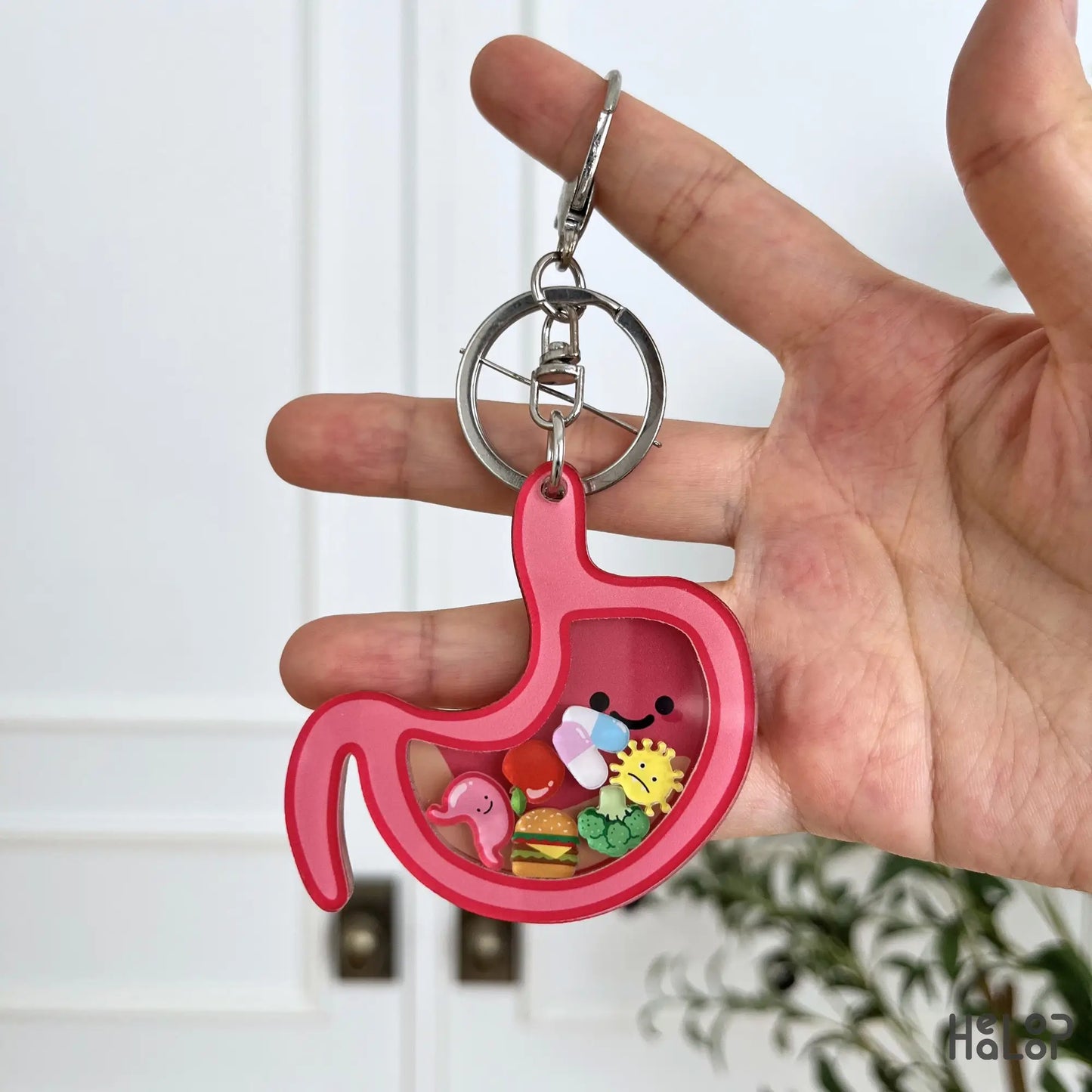 Cute stomach shaker keychain with food and medical charms for GI nurses and gastroenterology professionals.