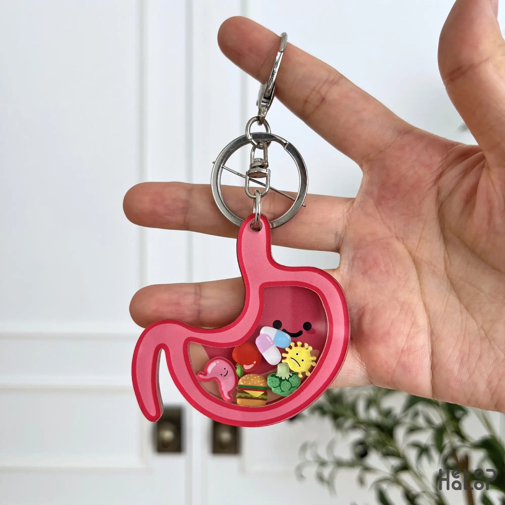 Cute stomach shaker keychain with food and medical charms for GI nurses and gastroenterology professionals.