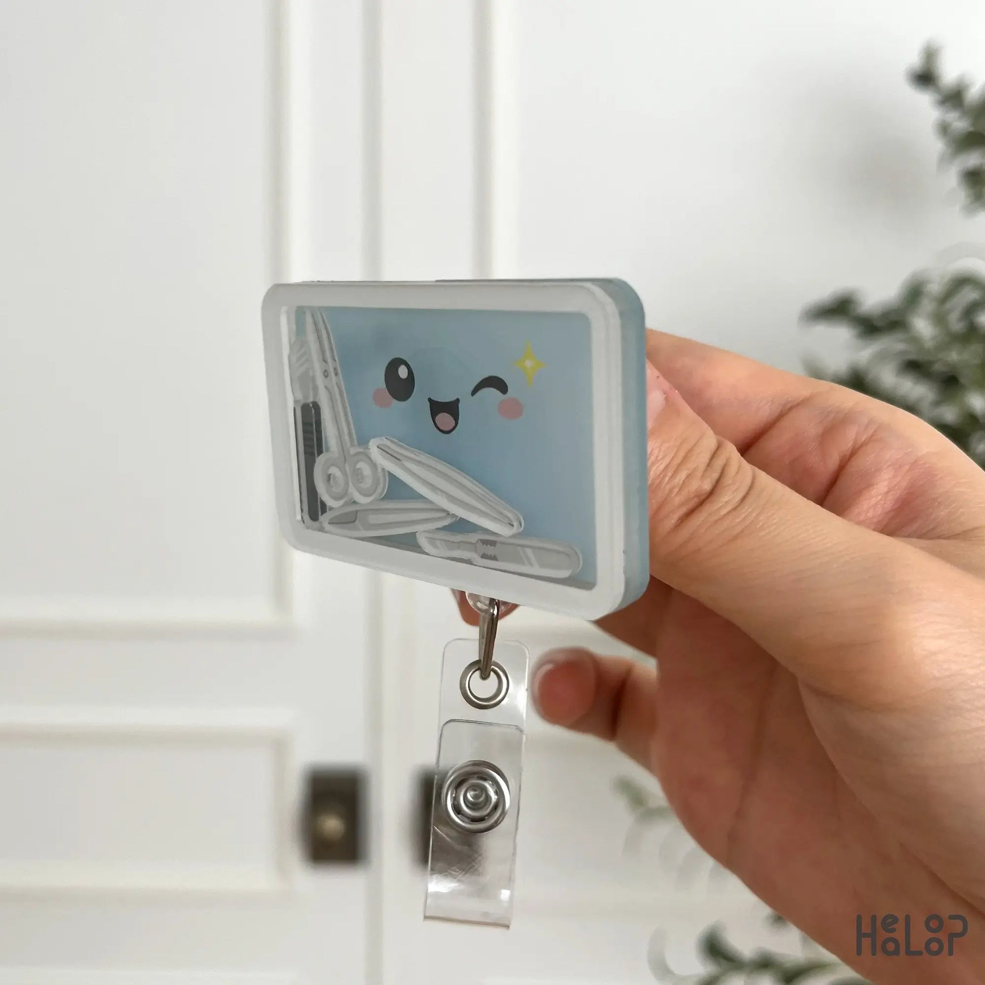 Side view of surgery tech shaker badge reel showing acrylic shaker design
