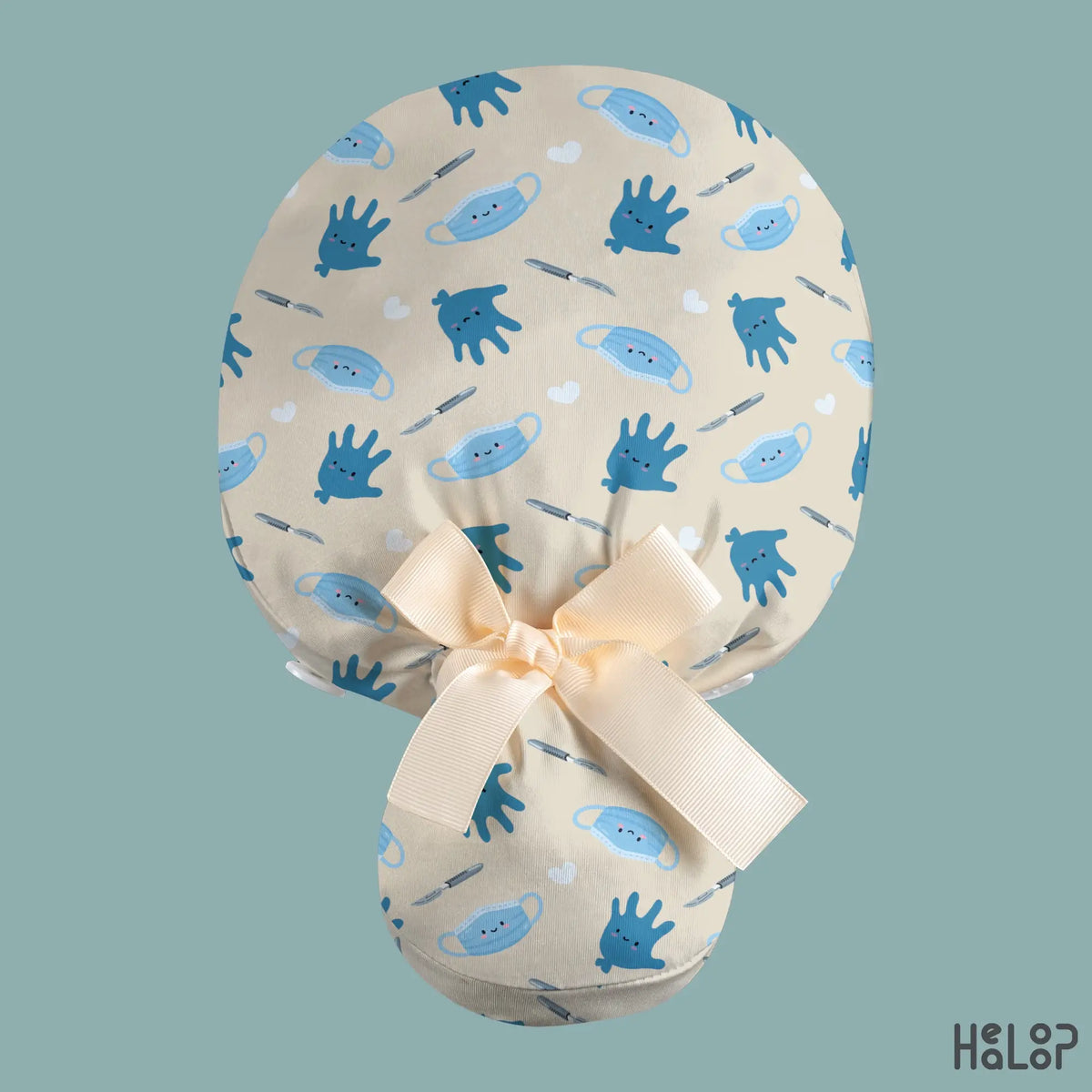 Surgical Ponytail Scrub Cap shown from the back, featuring cute blue surgical gloves, masks, scalpels, and white hearts on cream fabric with a cream ribbon bow and ponytail pouch.