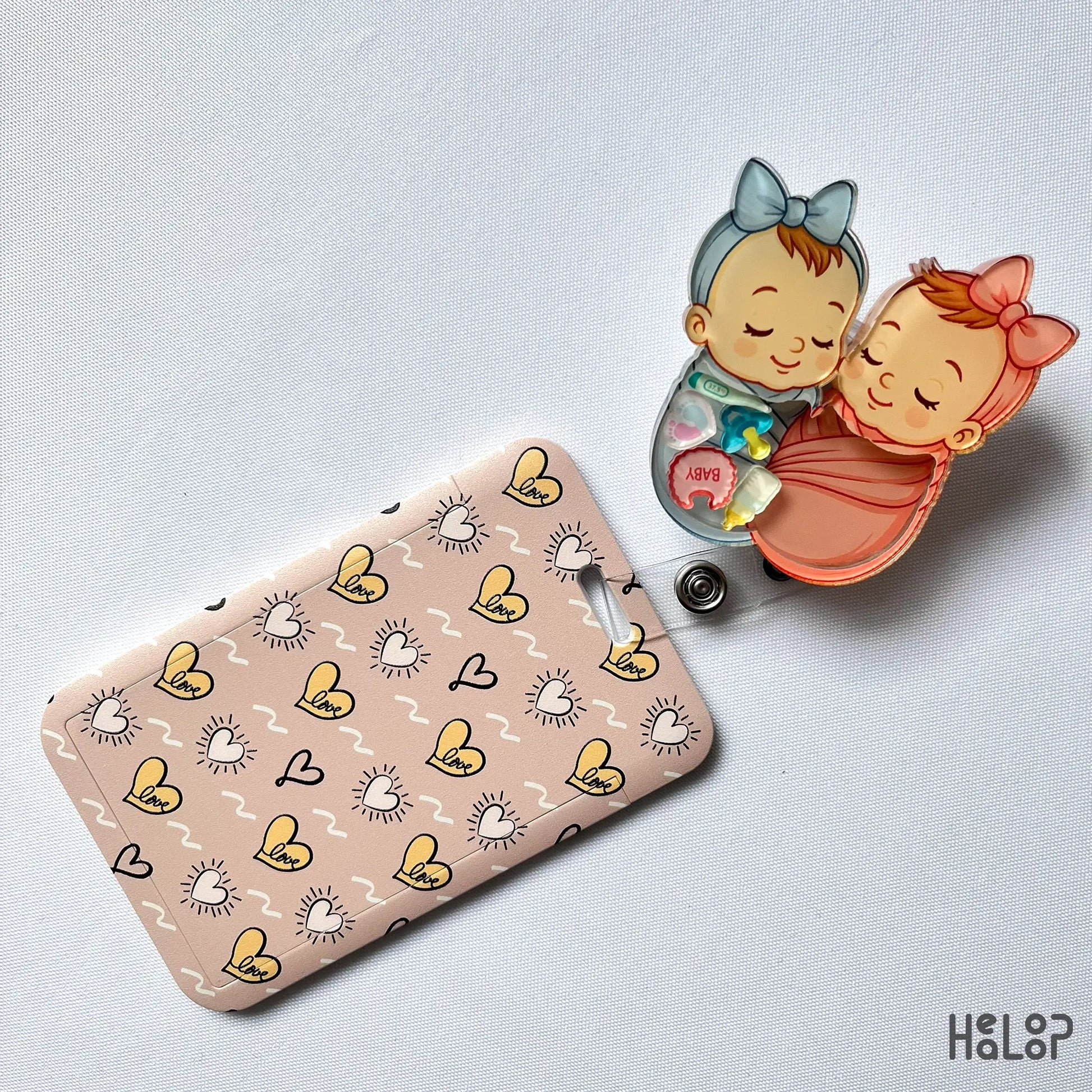 Swaddle Baby Shaker Badge Reel with matching ID card holder — perfect for NICU or hospital staff