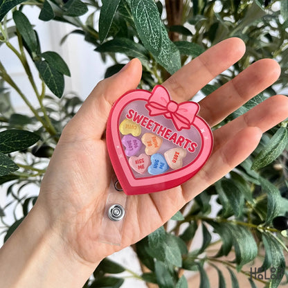 Sweethearts heart candy shaker badge reel with Valentine-themed charm pieces