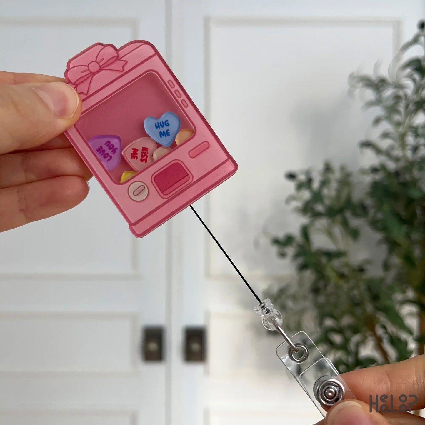 Sweethearts vending machine badge reel showing retractable cord