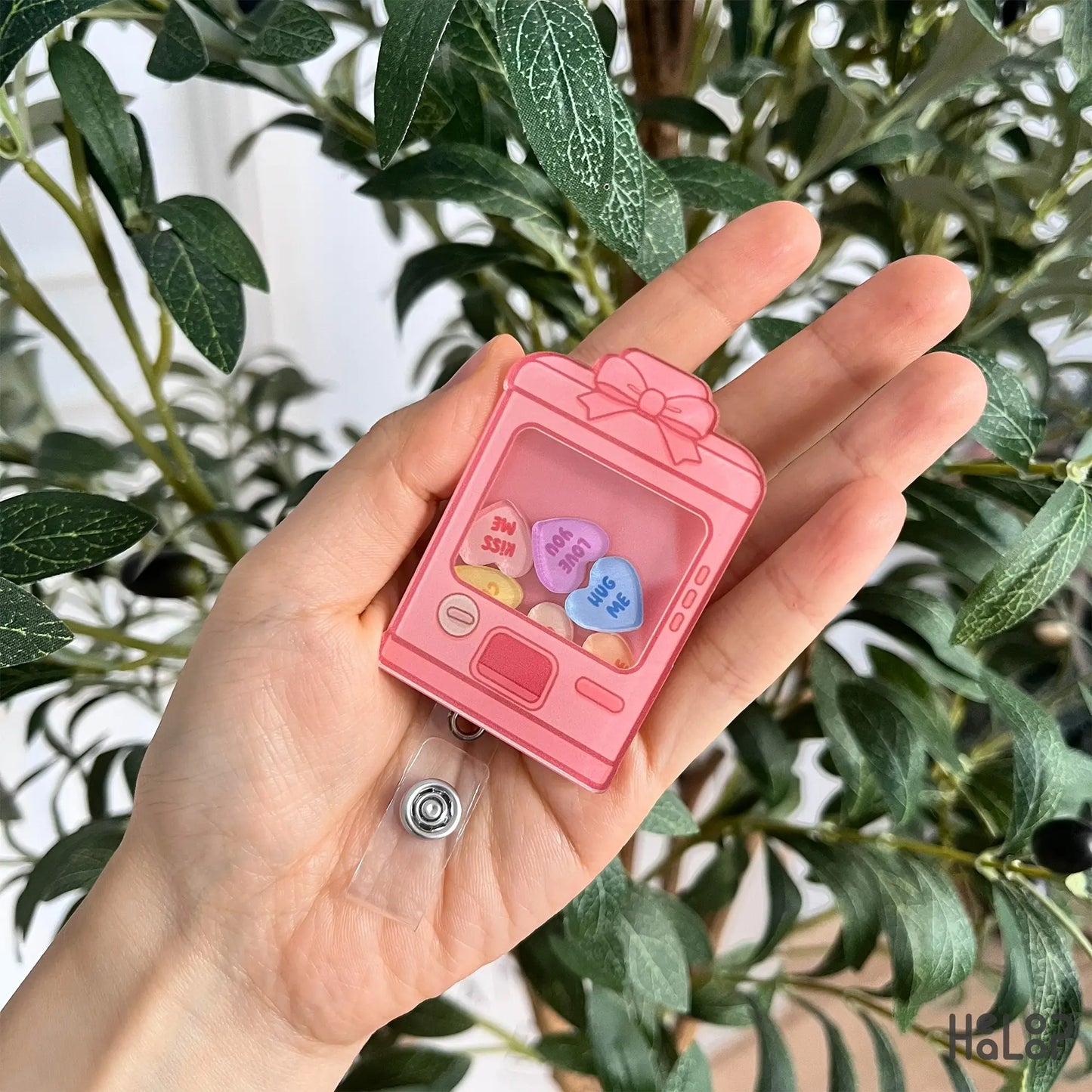 Sweethearts vending machine shaker badge reel front view