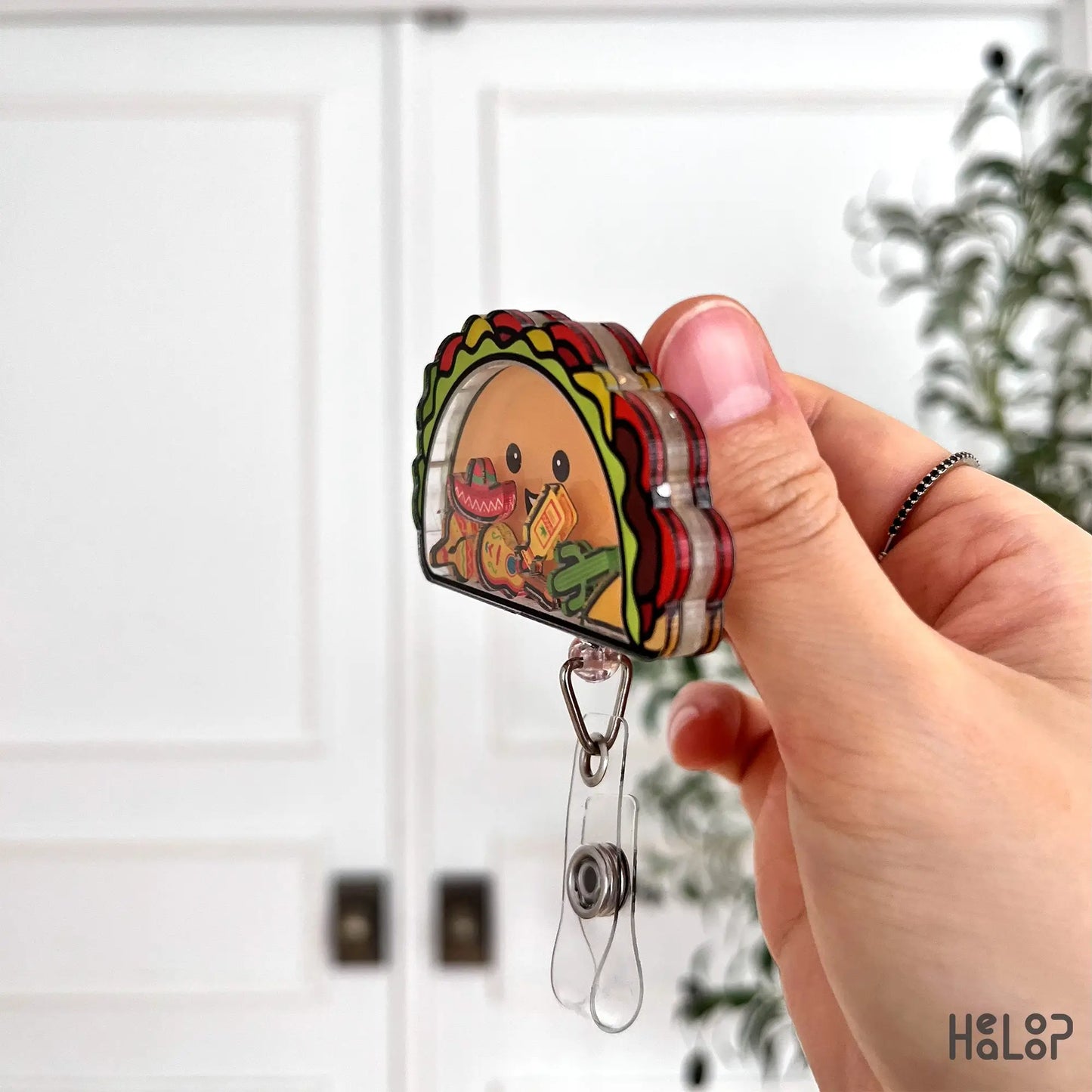 Side view of taco shaker badge reel acrylic layers