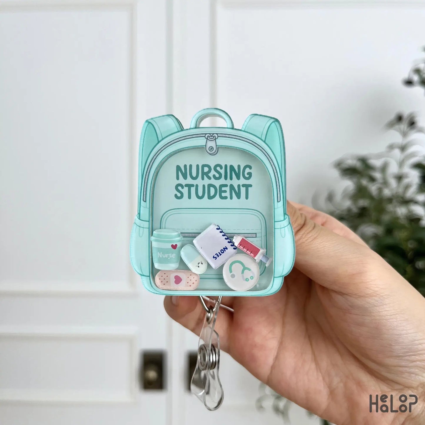 Teal Nursing Student Shaker Badge Reel with moving medical charms and retractable ID badge holder
