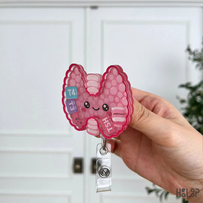 Premium layered acrylic Thyroid Shaker Badge Reel from Healoop shown from the side to highlight its shaker construction.