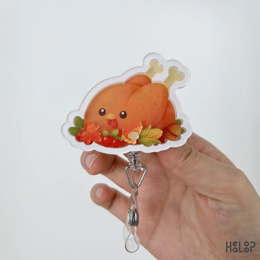 Close-up of Turkey Food Shaker Badge Reel featuring cute turkey, pumpkin pie, corn, cranberries, acorn, and autumn leaves