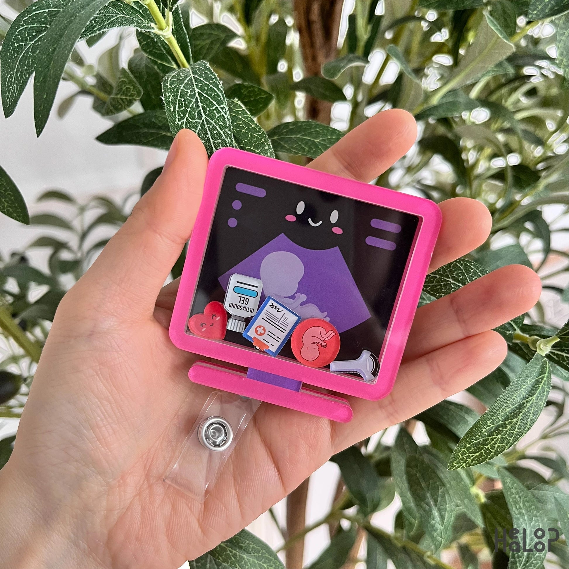 Ultrasound shaker badge reel in pink with medical charms.