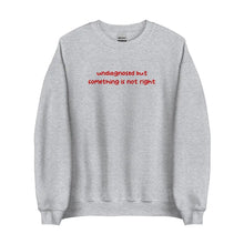 Sport-Grey-colored sweatshirt with 'undiagnosed but something is not right' embroidered in red, displayed flat for a detailed view.