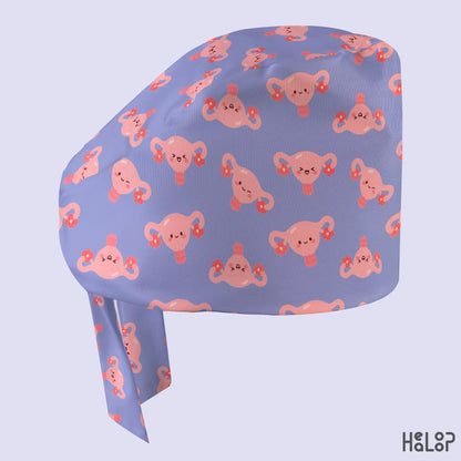 Cute uterus classic surgical hat side view, featuring pink uterus characters with different expressions and floral accents on lavender fabric. Copy