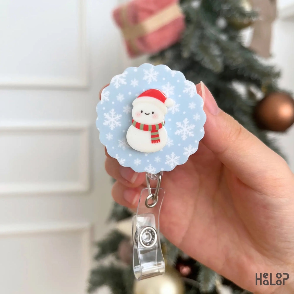 Winter Snowman Badge Reel with light blue snowflake pattern, cute seasonal ID holder for work