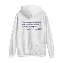 Ash hoodie with 'You are enough' printed in blue on the front and back print message 'Dear person behind me, your presence makes this world brighter,' emphasizing positivity and mental health.