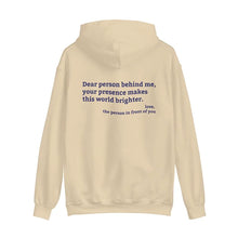 Sand hoodie with 'You are enough' printed in blue on the front and back print message 'Dear person behind me, your presence makes this world brighter,' emphasizing positivity and mental health.